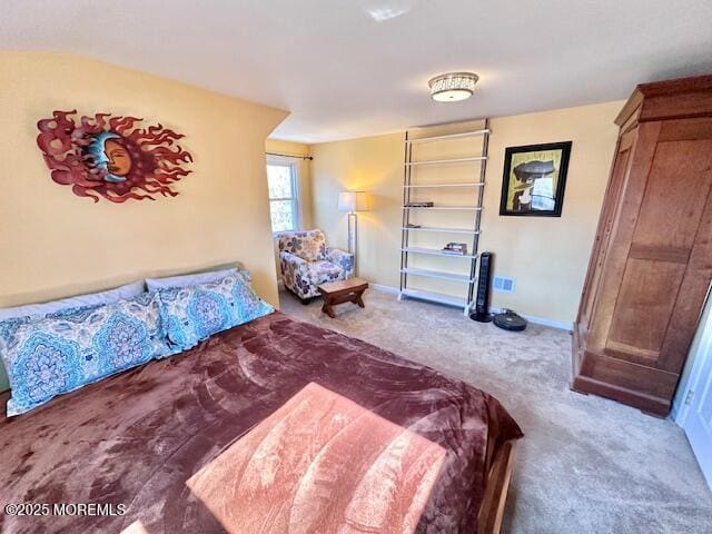 carpeted bedroom featuring baseboards