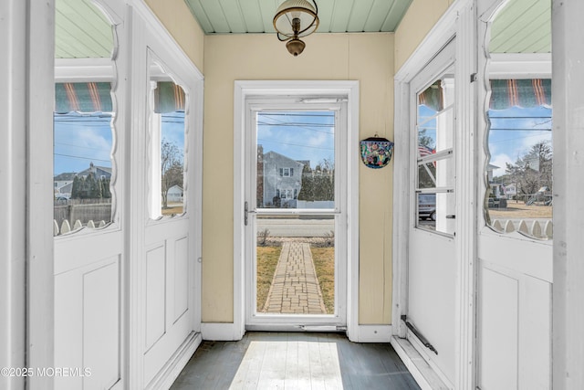 entryway with dark wood-style floors