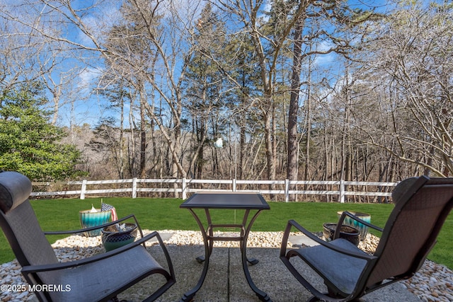 view of yard featuring fence and a patio