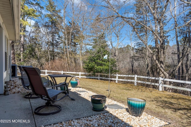 view of yard with fence and a patio