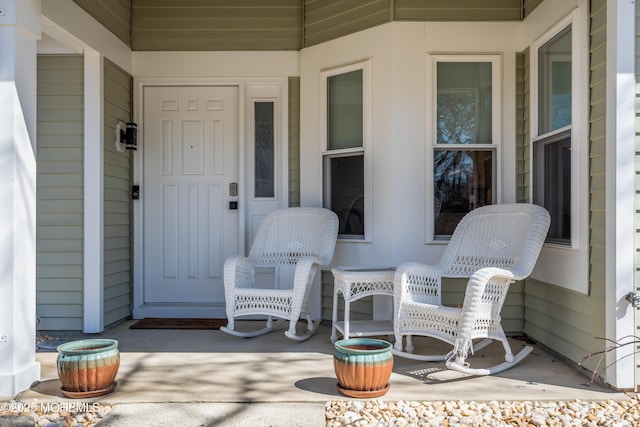 view of exterior entry with covered porch