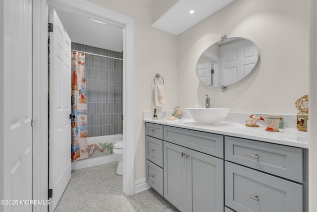 bathroom featuring shower / tub combo, vanity, toilet, and recessed lighting