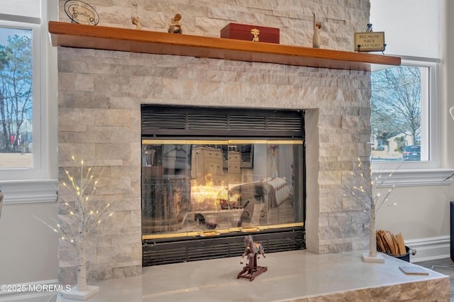 room details with a glass covered fireplace