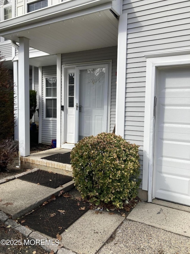 property entrance with a garage