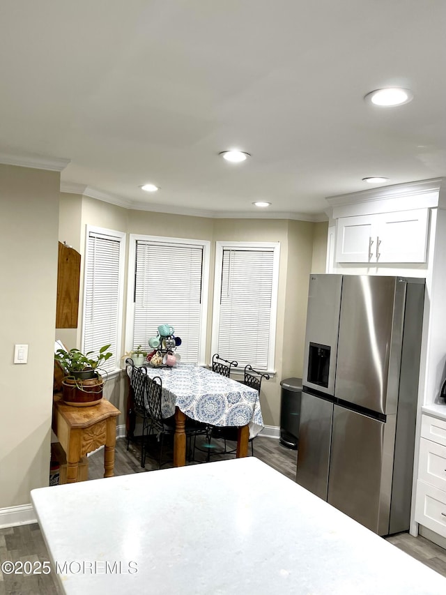 dining space featuring recessed lighting, baseboards, ornamental molding, and dark wood-style flooring