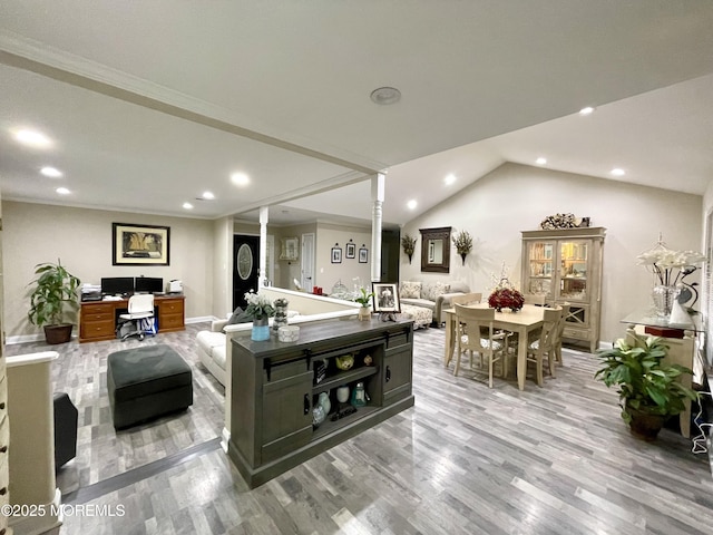 living area featuring light wood-style flooring, recessed lighting, crown molding, lofted ceiling, and ornate columns