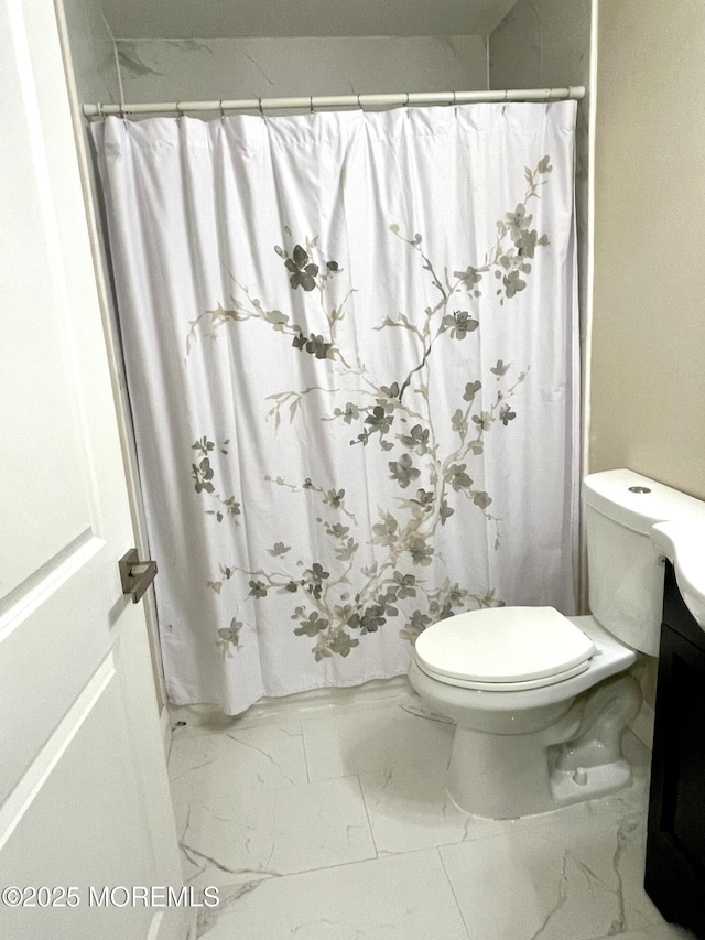 full bathroom with vanity, toilet, a shower with curtain, and marble finish floor