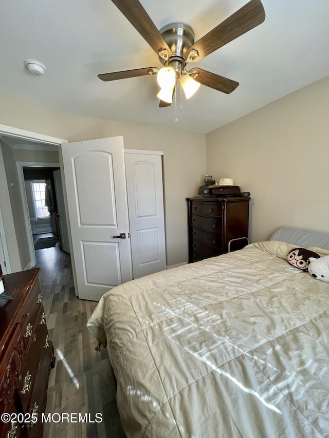 bedroom with wood finished floors and ceiling fan