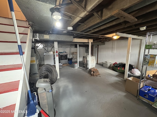 unfinished basement with washer / clothes dryer