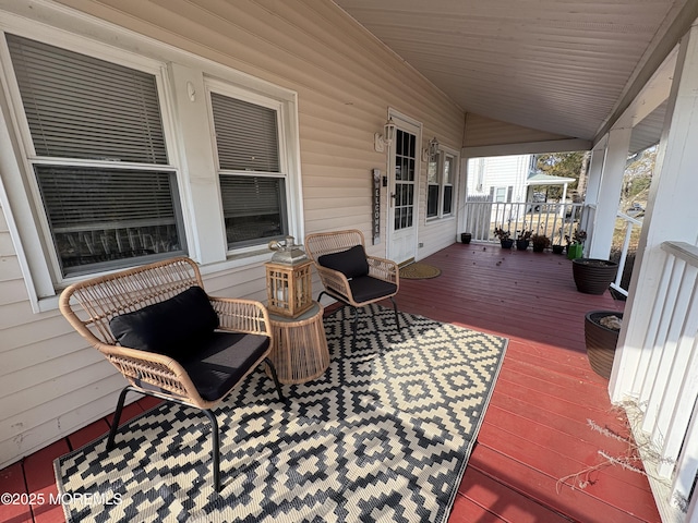 wooden terrace with a porch