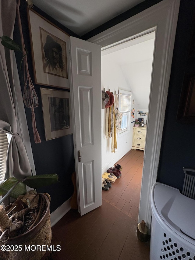 bathroom featuring baseboards and hardwood / wood-style floors