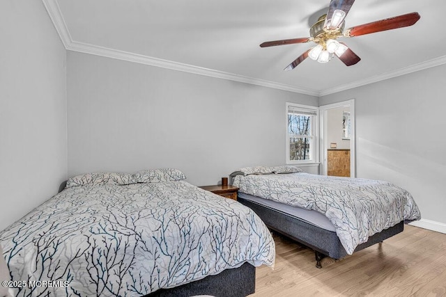 bedroom with ceiling fan, ornamental molding, and wood finished floors