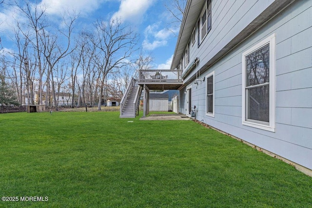 view of yard featuring stairway and a wooden deck