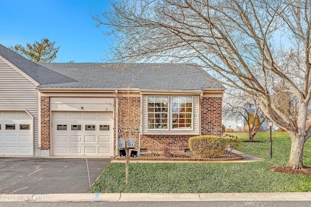 view of front of house with brick siding, crawl space, an attached garage, and aphalt driveway