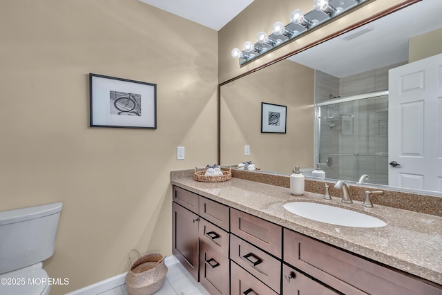 bathroom featuring a stall shower, baseboards, toilet, tile patterned floors, and vanity