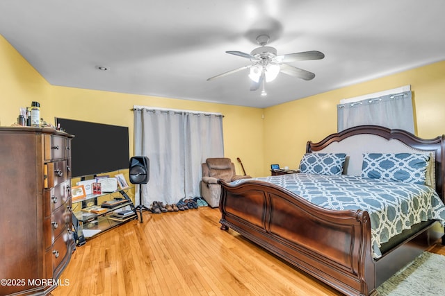 bedroom featuring ceiling fan and wood finished floors