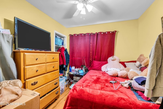 bedroom featuring wood finished floors and a ceiling fan