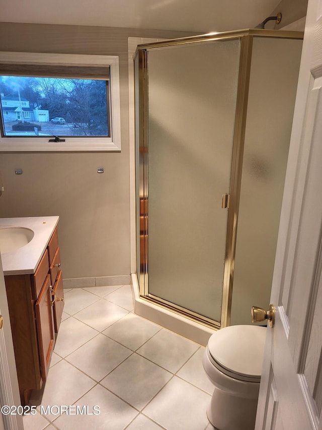 full bath with tile patterned flooring, toilet, a shower stall, and vanity