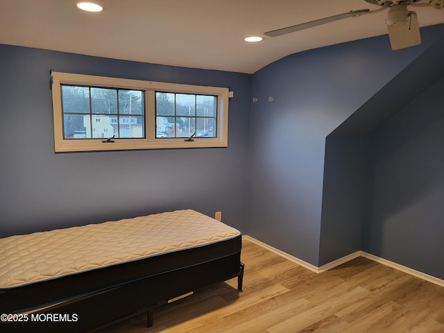 bedroom featuring light wood-style flooring, baseboards, and recessed lighting