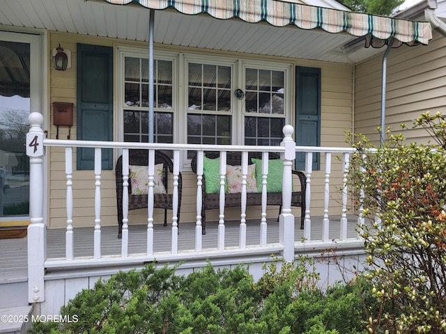 view of exterior entry with a porch