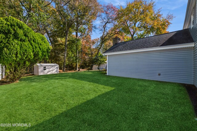 view of yard with a shed and an outdoor structure