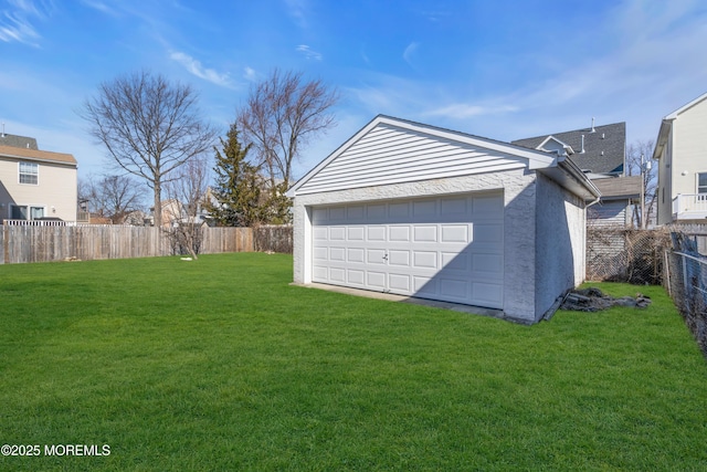 detached garage featuring fence