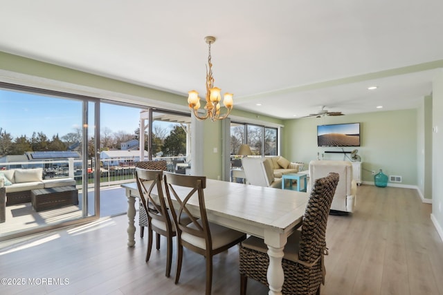 dining room with visible vents, recessed lighting, baseboards, and light wood finished floors