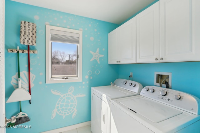 laundry room featuring cabinet space, separate washer and dryer, and baseboards