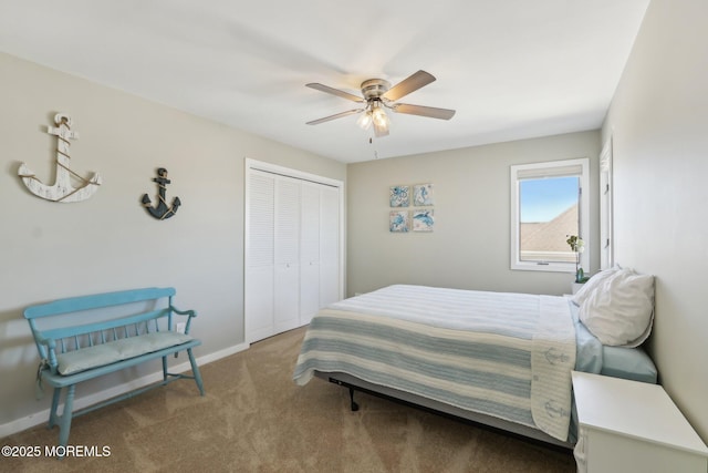 carpeted bedroom with a closet, a ceiling fan, and baseboards