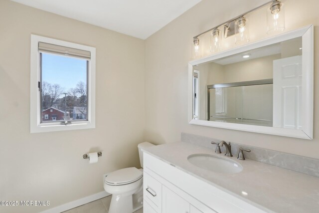 bathroom with tile patterned floors, an enclosed shower, toilet, baseboards, and vanity