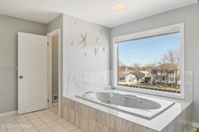 full bath with tile patterned floors and a jetted tub