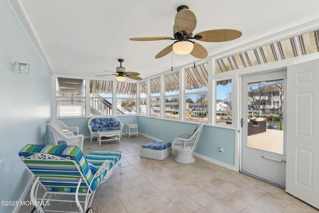 sunroom with ceiling fan