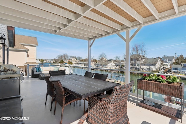 view of patio / terrace featuring outdoor dining area and a water view