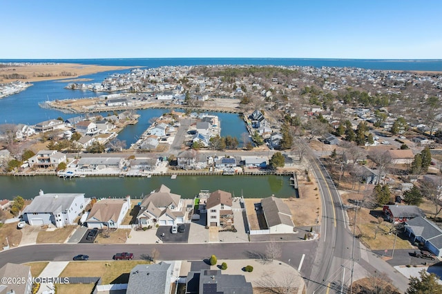 bird's eye view with a residential view and a water view