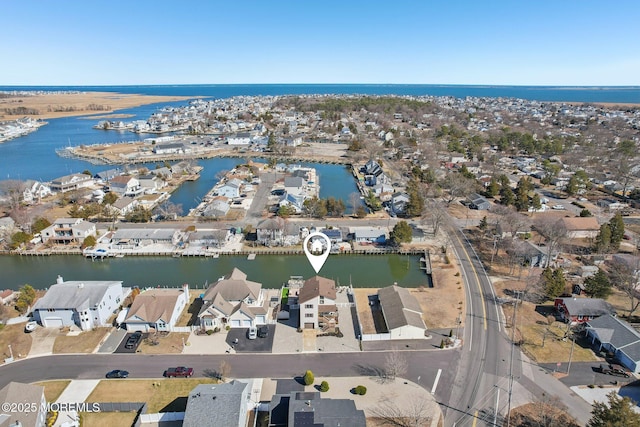 aerial view with a water view and a residential view