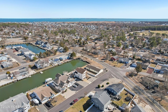 aerial view featuring a residential view and a water view