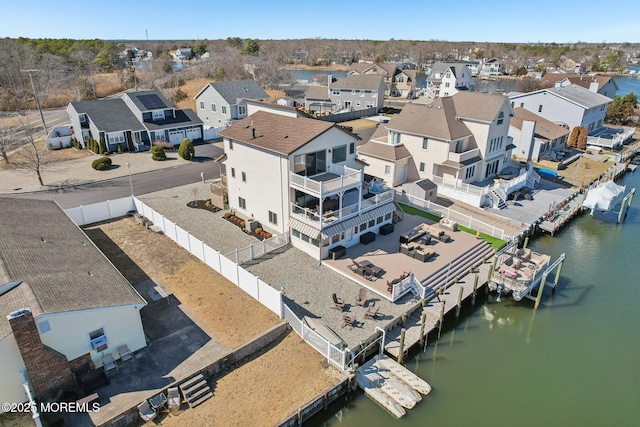 birds eye view of property with a residential view and a water view