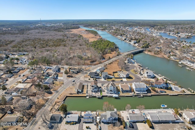 birds eye view of property with a residential view and a water view