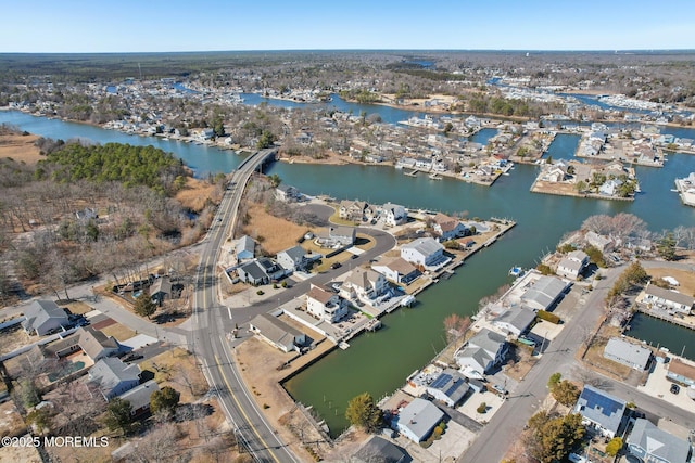 birds eye view of property with a residential view and a water view