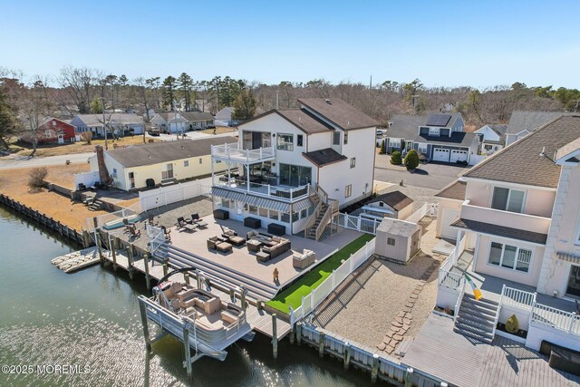 bird's eye view featuring a residential view and a water view