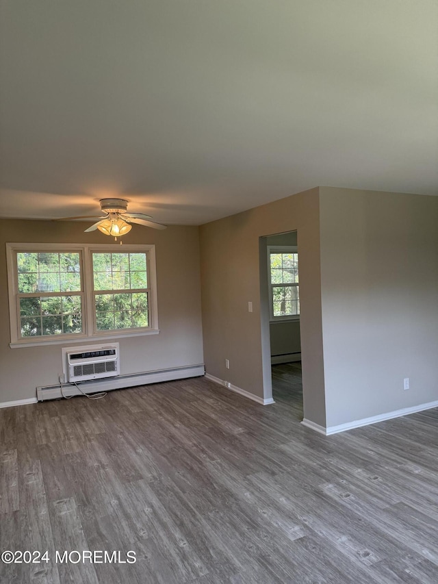 empty room with a ceiling fan, a baseboard radiator, baseboards, and dark wood-type flooring