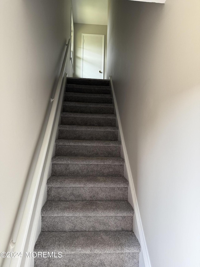 stairway with baseboards