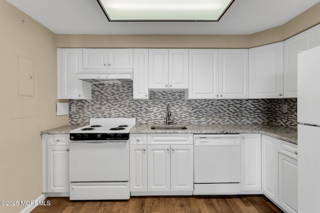 kitchen with tasteful backsplash, under cabinet range hood, white appliances, white cabinetry, and a sink