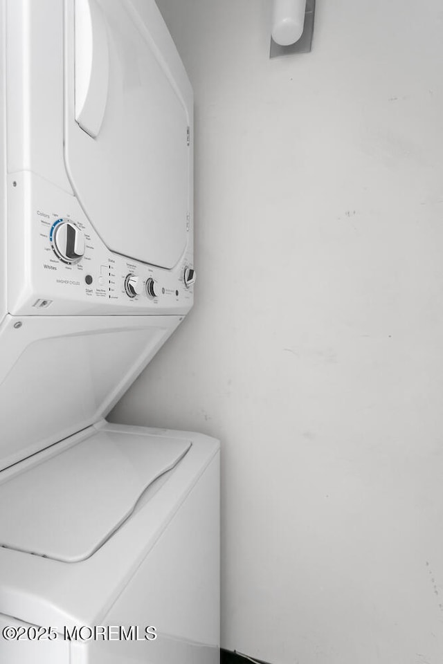 washroom with laundry area and stacked washer and dryer