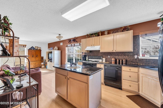 kitchen with range with gas cooktop, light brown cabinets, dishwasher, and under cabinet range hood