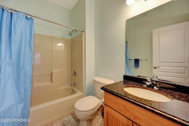 bathroom with shower / tub combo, vanity, and toilet