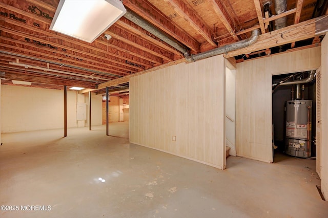 unfinished basement featuring gas water heater