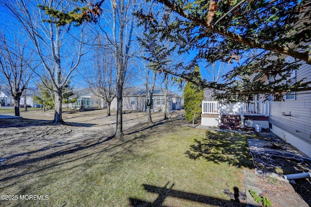 view of yard with a deck and a residential view