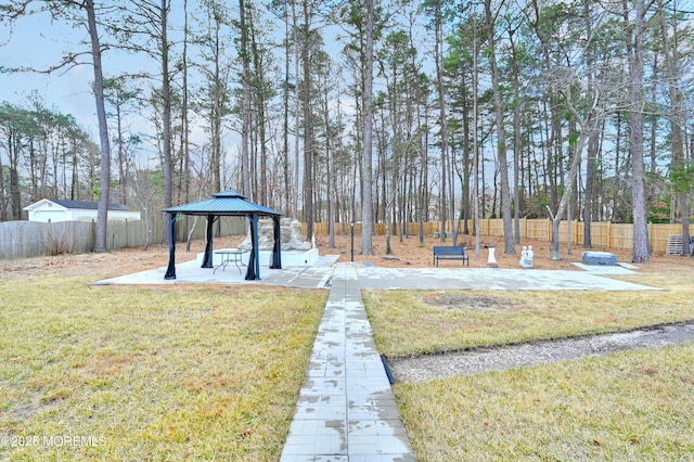 view of yard featuring fence and a gazebo