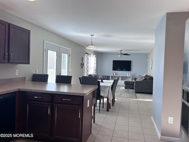 kitchen with light tile patterned floors, black dishwasher, a ceiling fan, open floor plan, and a peninsula